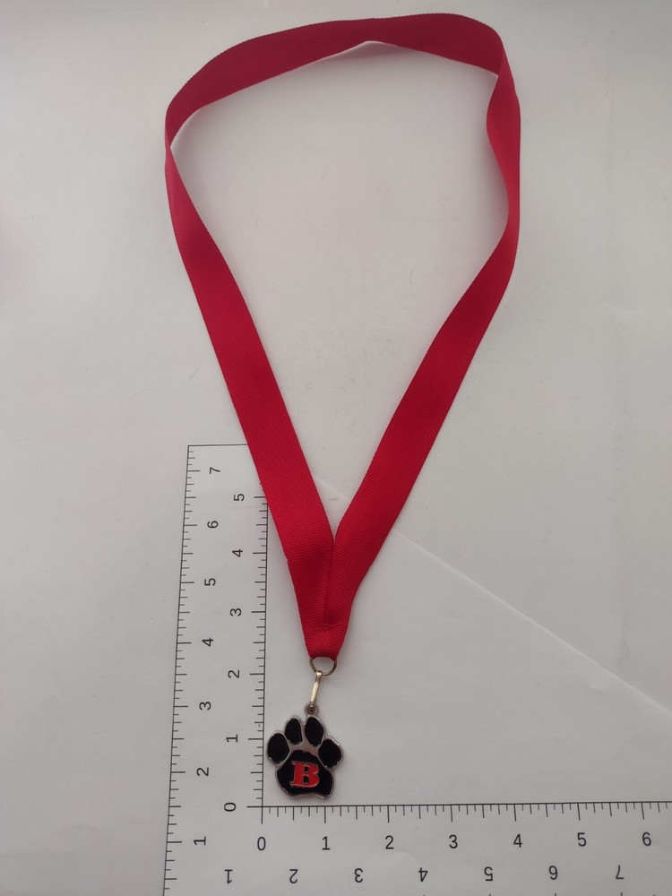 Medal – Black Paw with a Red Letter B