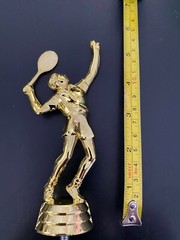 A variety of Tennis Man trophy toppers