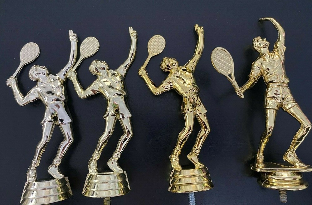 A variety of Tennis Man trophy toppers